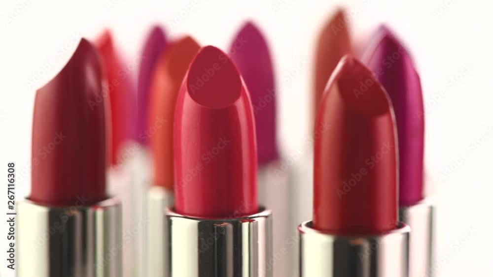 Lipstick tints palette. Fashion colorful lipsticks rotated over white background. Professional makeup and beauty. 4K UHD video footage. 3840X2160 Lipstick tints palette. Fashion colorful lipsticks rotated over white background. Professional makeup and beauty. 4K UHD video footage. 3840X2160