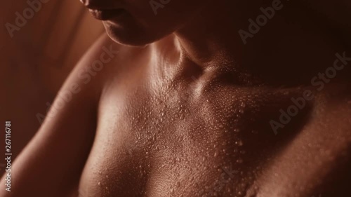 skin treatments in the sauna. a girl in a white towel on her head takes skin care procedures in a Finnish sauna.