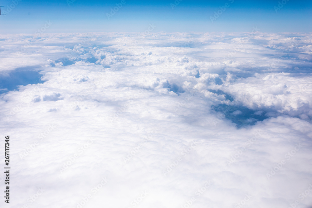 Earth in the airplane window with clouds Earth in the airplane window with clouds