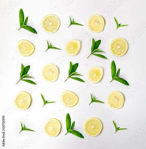 Fototapeta Naklejka Na Ścianę i Meble -  Pattern of mint and lemon. Food background with citrus. Mint leaves, lemon slices isolated on white background. Top view, flat lay