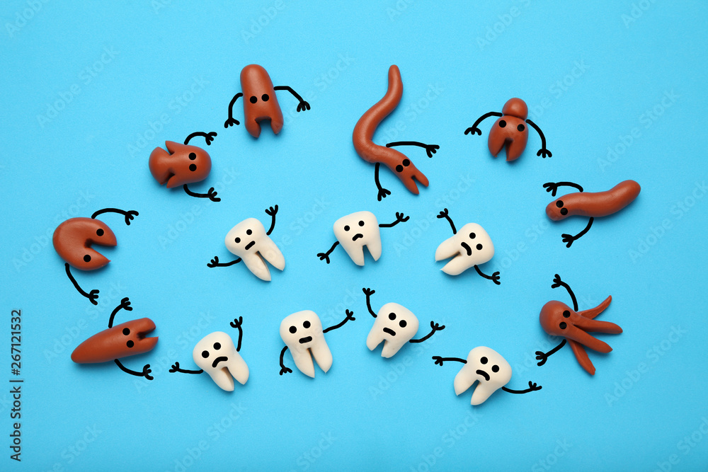 Baby teeth and scary cartoon caries concept. Prevention of oral cavity. Baby dental treatment.