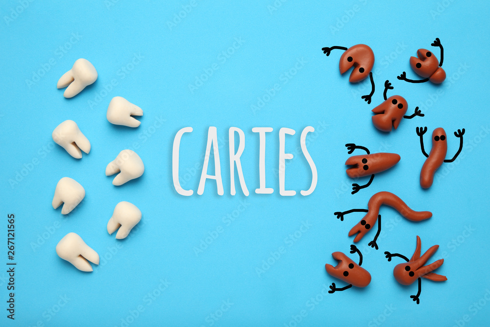 Baby teeth and scary cartoon caries concept. Prevention of oral cavity. Baby dental treatment. Baby teeth and scary cartoon caries concept. Prevention of oral cavity. Baby dental treatment.