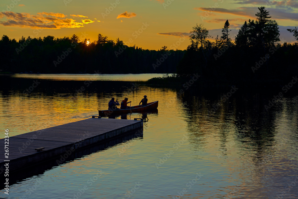 canoeing at sunset, sawbill lake, mn