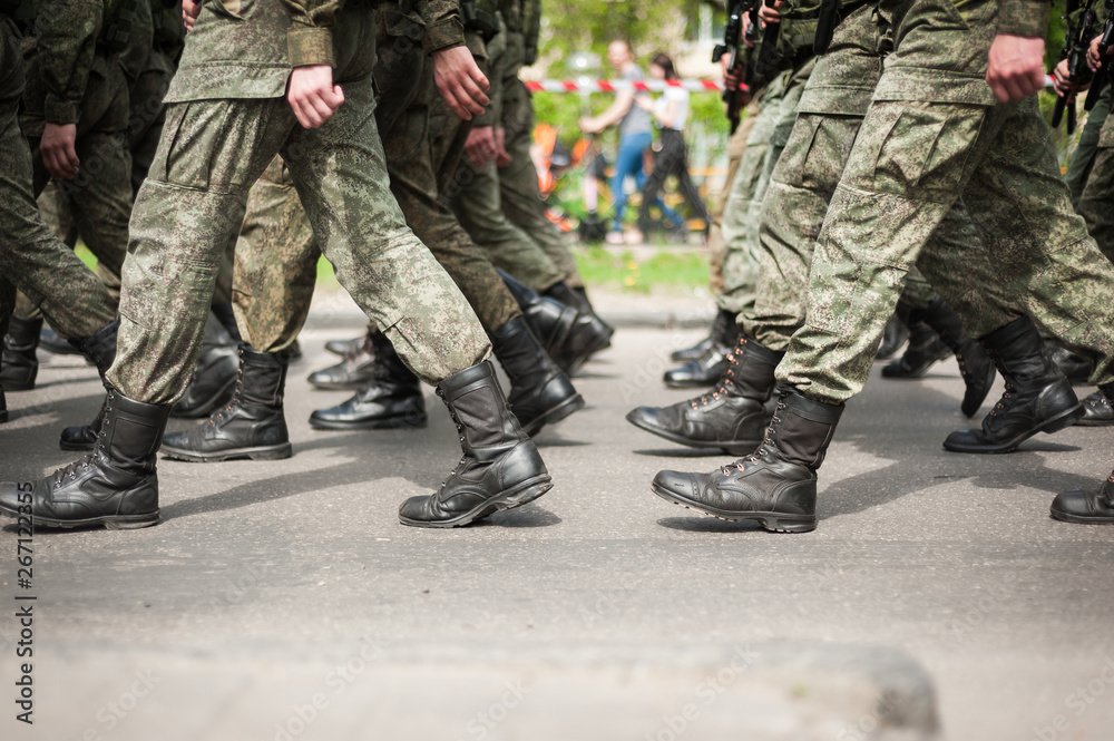 Marching soldiers in military boots Marching soldiers in military boots