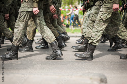 Marching soldiers in military boots