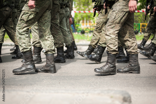 Marching soldiers in military boots