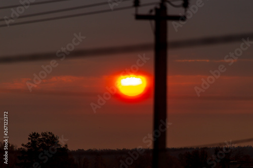 Electric pole at sunset as background