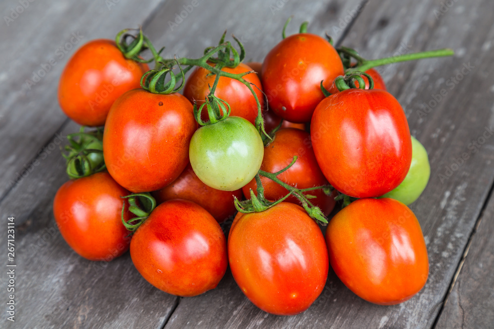 tomatoes on wooden background tomatoes on wooden background