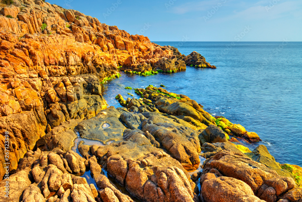 Beautiful landscape with rocky shore and blue sea