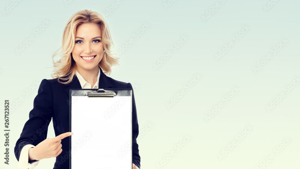 Photo of young businesswoman showing blank clipboard Photo of young businesswoman showing blank clipboard