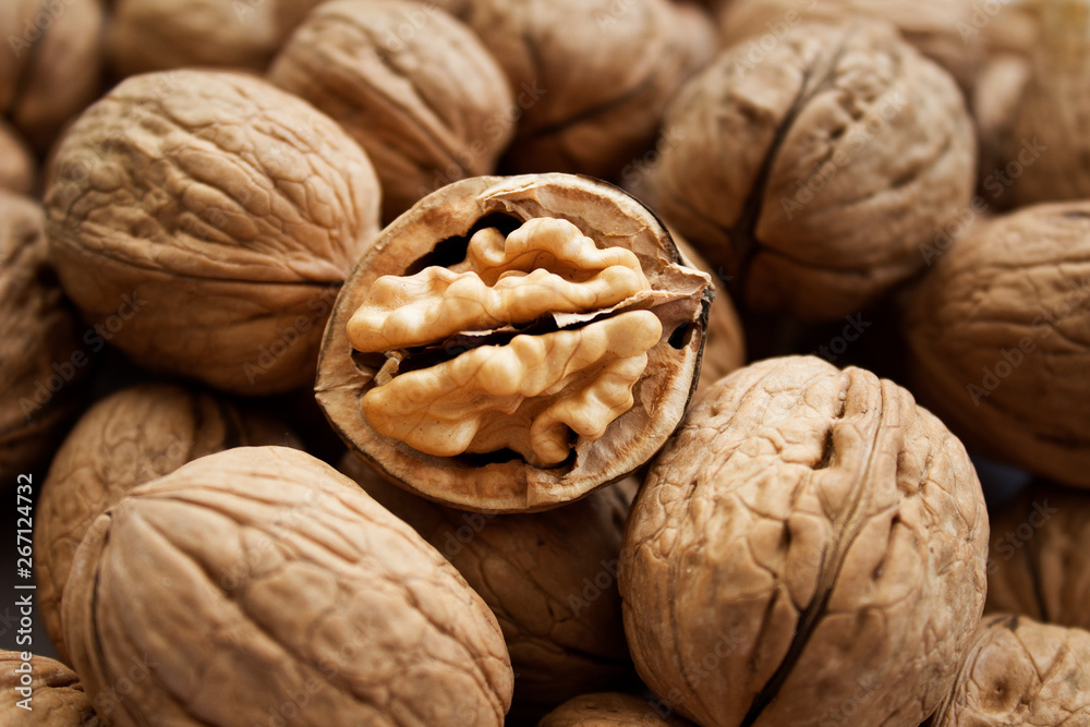 Walnuts kernels on dark desk with color background Walnuts kernels on dark desk with color background