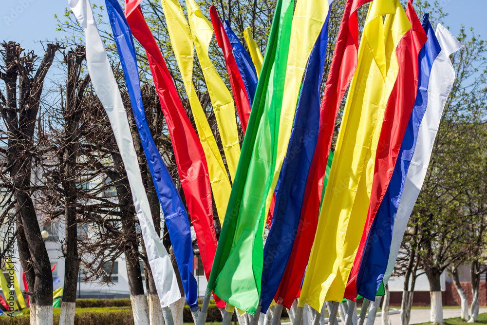 color holiday flags on the Sunny streets of Russia