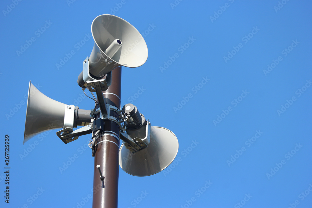 security speakers tower for warning or announce with clear blue sky background security speakers tower for warning or announce with clear blue sky background
