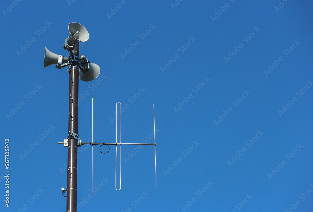 security speakers tower for warning or announce with clear blue sky background security speakers tower for warning or announce with clear blue sky background