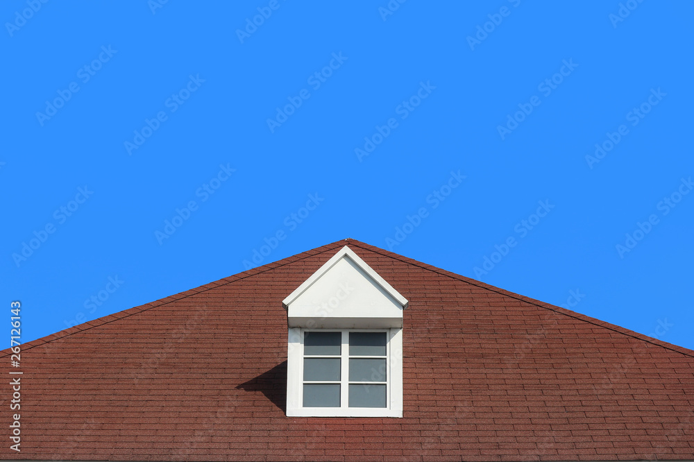 modern gable roof design house wall with clear blue sky background.