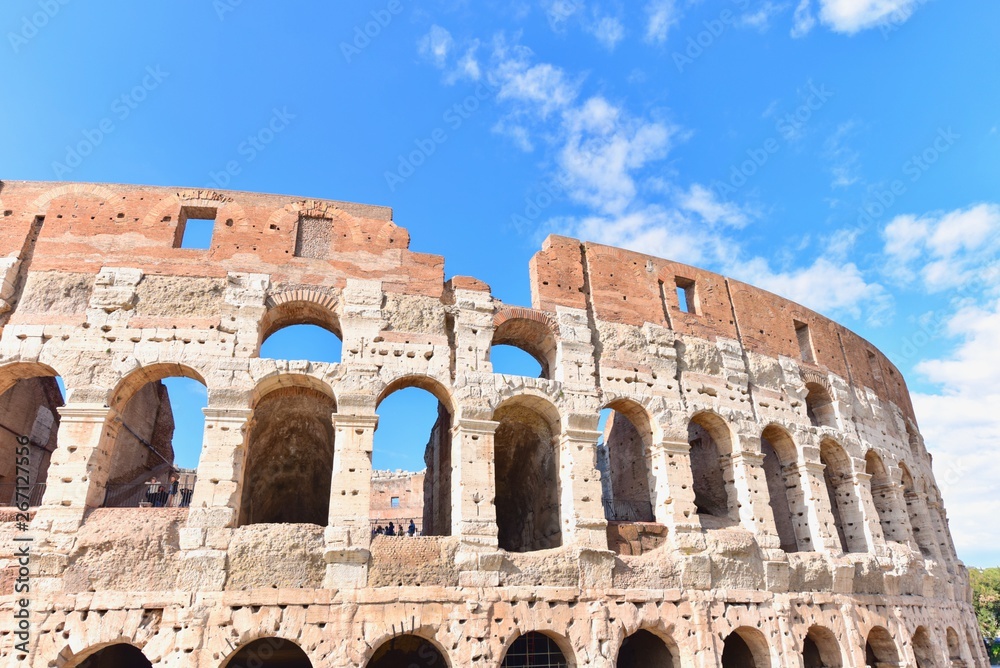The Ancient Roman Colosseum Against Blue Skies
