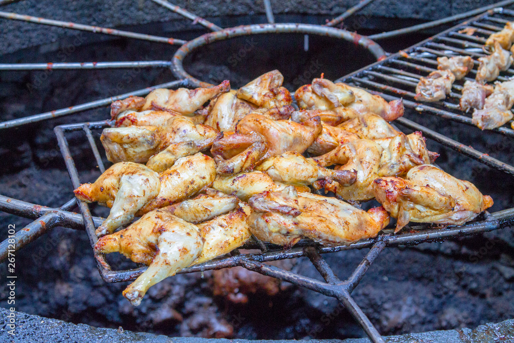 Chicken legs on the grill grill over the natural heat of a volcano in the El Diablo Canary Islands National Park. Spain Lanserote