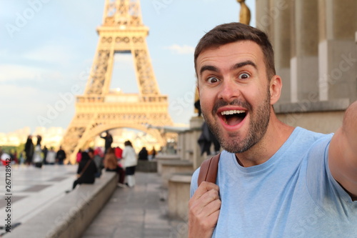 Photography Excited man taking a selfie in the Eiffel Tower, Paris