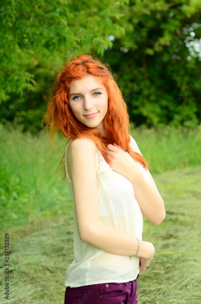 A young beautiful ore girl of the Caucasian appearance is having fun with pineapple. Place for text.Vegan, vegetarianism, healthy lifestyle, positive concept A young beautiful ore girl of the Caucasian appearance is having fun with pineapple. Place for text.Vegan, vegetarianism, healthy lifestyle, positive concept