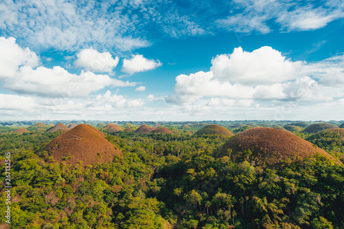 Chocolate Hills in the Bohol island in the Philippines, covered in brown grass. Famous touristic place