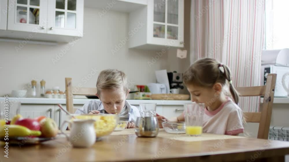 children cew their cornflakes snack but boy dont like it at all children cew their cornflakes snack but boy dont like it at all