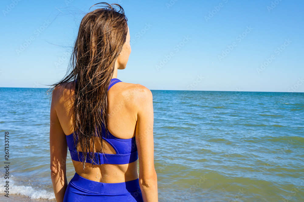 Long haired girl in bikini on tropical beach Long haired girl in bikini on tropical beach