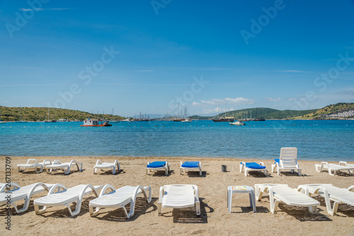 Beautiful exotic beach with deck chairs in Bodrum  Turkey