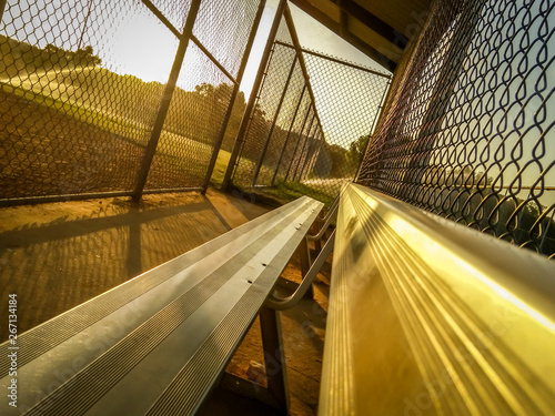 Photography Angled Photo of a Baseball Dugout at Sunset - with Bleacher Seats, Chainlink Fen