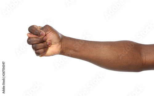 African-American man showing fig gesture on white background, closeup