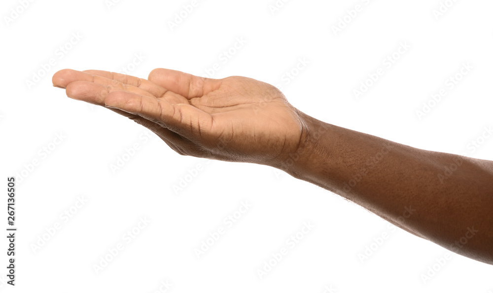 African-American man holding something in hand on white background, closeup African-American man holding something in hand on white background, closeup