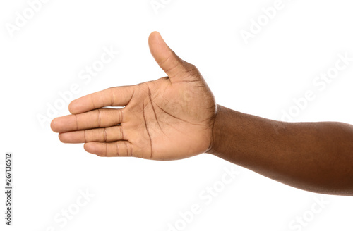 African-American man extending hand for shake on white background, closeup