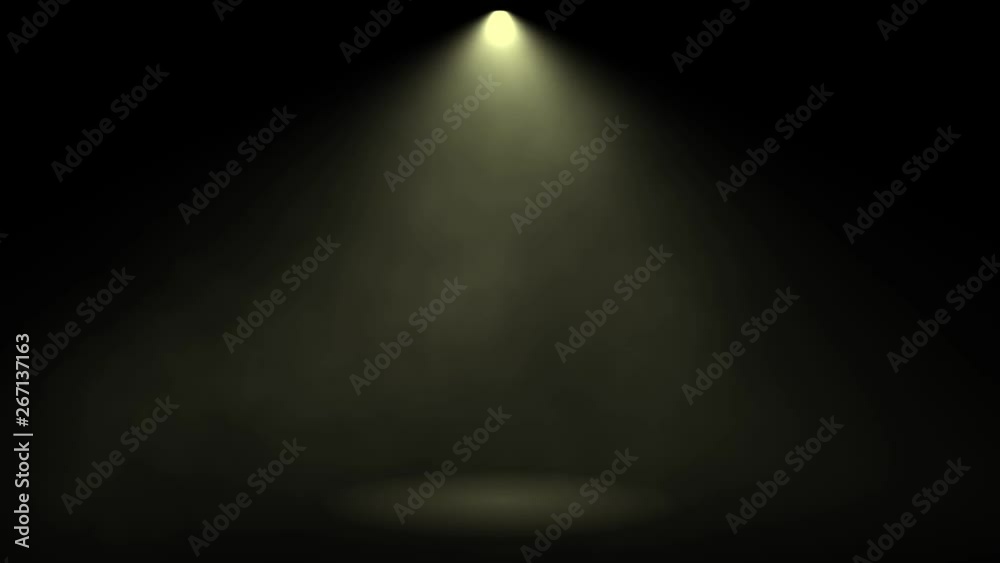 Theatrical smoke. The rays of light from the floodlights at the theater during the performance. Gradual turning off of the light source with dimmer switch. Lighting equipment