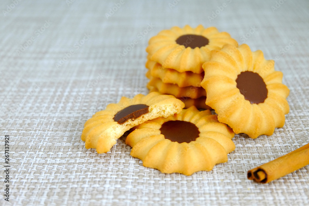 Group of round cookies, Chocolate cookies and cinnamon, Bakery on table Group of round cookies, Chocolate cookies and cinnamon, Bakery on table