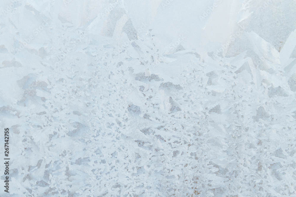 Fototapeta premium Frosty patterns on a frozen ice box in the early morning