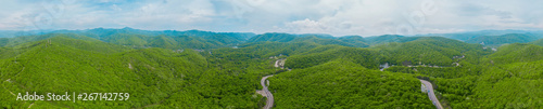Caucasus mountains and forest panorama, rural road