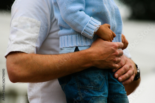 Intimate gesture of trust between a father and his son