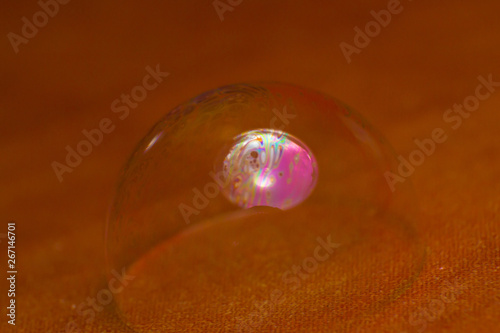 pink soap bubble inside a transparent bubble