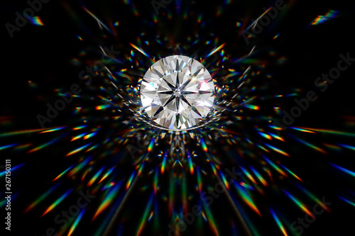 Round diamond on black background with beautiful caustics rays
