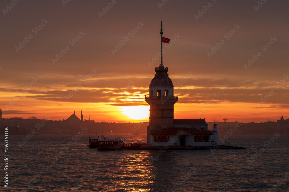Sunset with Maiden's Tower on Bosphorus and view of historical peninsula. The Maiden's Tower, also known as Leander's Tower (Tower of Leandros) since the medieval Byzantine period.