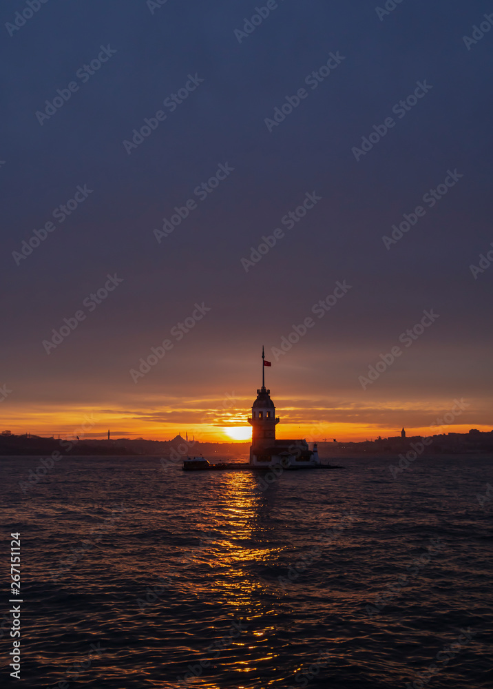 Sunset with Maiden's Tower on Bosphorus and view of historical peninsula. The Maiden's Tower, also known as Leander's Tower (Tower of Leandros) since the medieval Byzantine period.