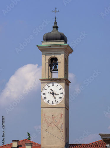 bell tower of the sanctuary with clock and sundial. saronno - Italy