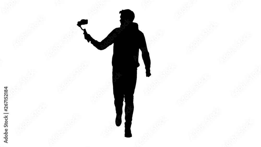 Cameraman's silhouette shooting himself while running using steadicam and smartphone. Cameraman's silhouette shooting himself while running using steadicam and smartphone.