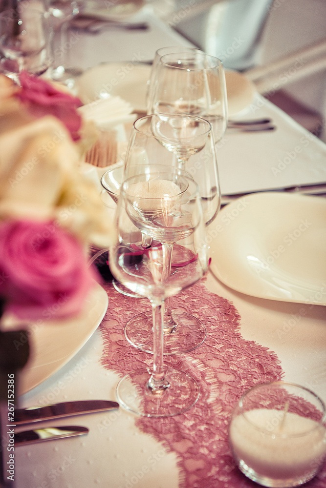  Wedding decorations. Rings on textiles, decorations with fresh flowers, candles, catering in purple tone. Stylish holiday atmosphere