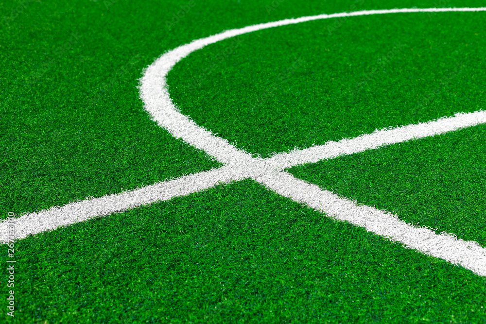 Painted White Lines And Fragment Of Circle On Green Artificial Turf On Soccer Field. Center Of Football Fiels. Painted White Lines And Fragment Of Circle On Green Artificial Turf On Soccer Field. Center Of Football Fiels.