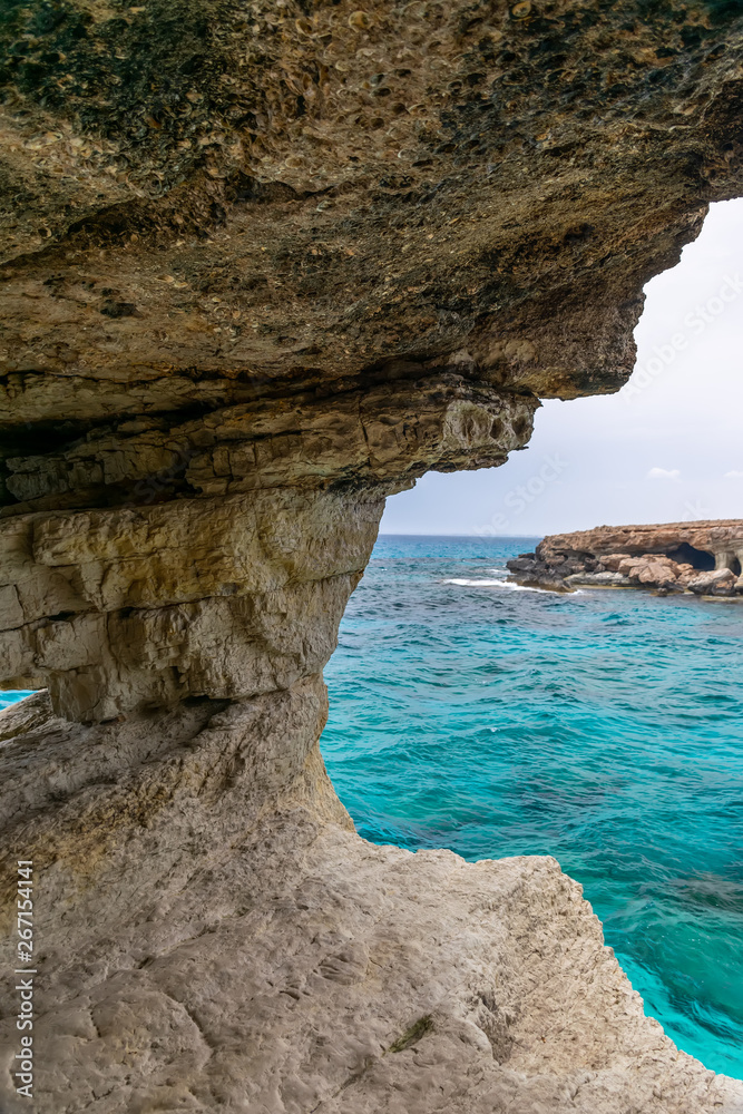 Fototapeta premium The picturesque cave is located on the shores of the Mediterranean Sea.