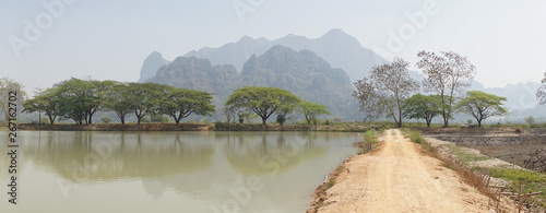 Kyaut Ka Latt Pagoda in a dry mountain landscape near Hpa-An, Burma, Myanmar.  photo