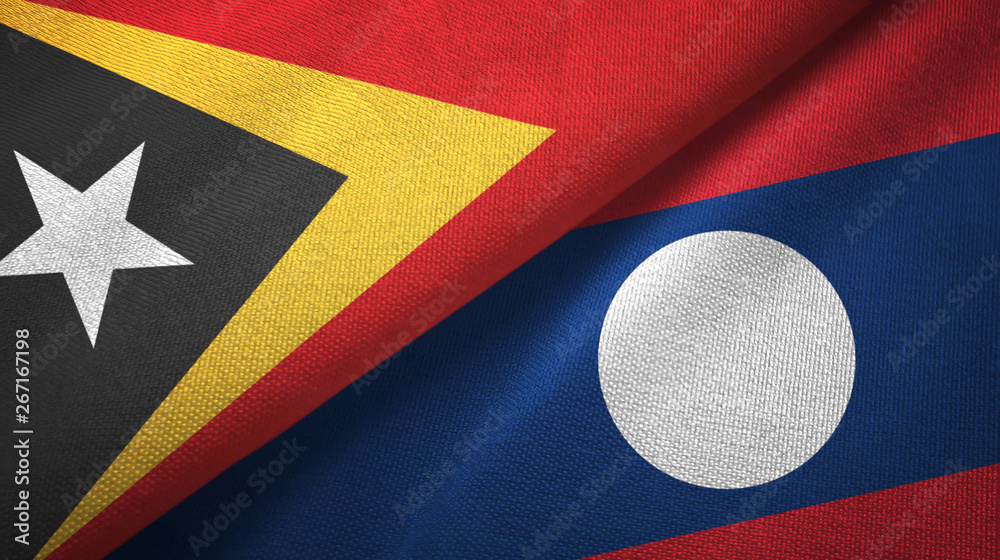 Fototapeta premium East Timor and Laos two flags textile cloth.