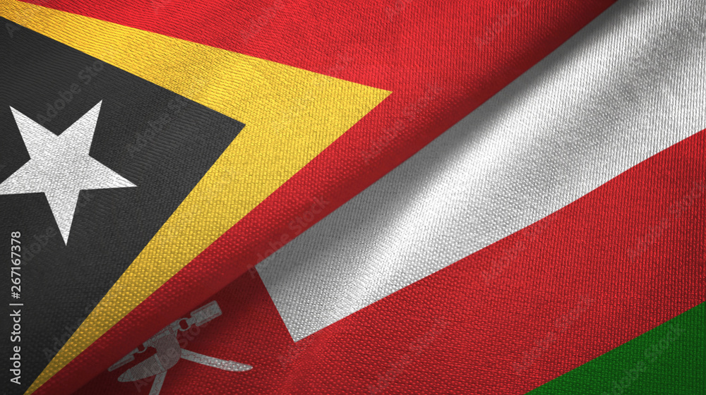 Fototapeta premium East Timor and Oman two flags textile cloth, fabric texture