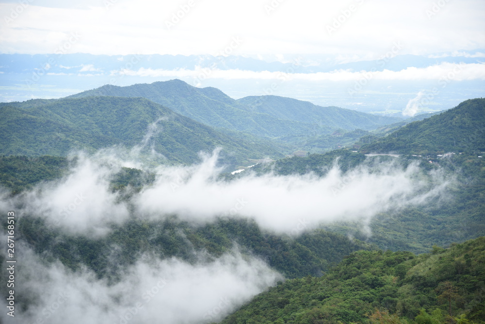 Aerial view of the morning foggy landscape in the mountains. The morning view on the hilltop.