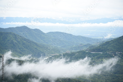 Aerial view of the morning foggy landscape in the mountains. The morning view on the hilltop.